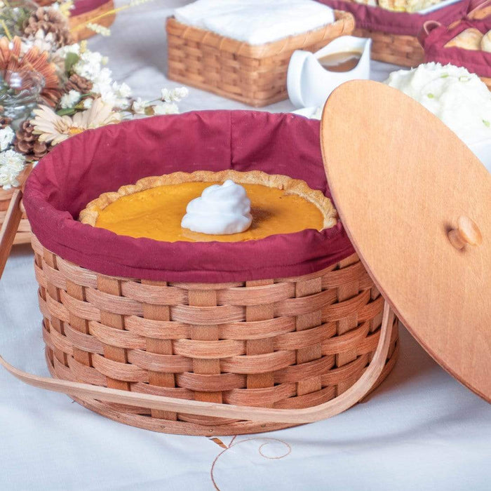 https://www.amishbaskets.com/cdn/shop/products/pie-baskets-amish-made-round-double-two-pie-carrier-basket-with-wood-swinging-handles-plain-28417956577383_700x700.jpg?v=1628078857